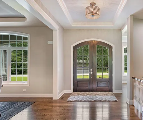 Elegant entryway featuring new windows and doors, highlighting the quality of installation services in Boston.
