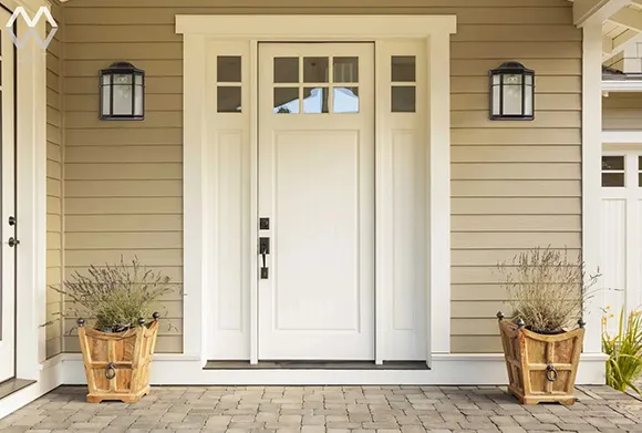 Exterior view of a house with a newly installed front door, representing quality window and door installation in Boston.