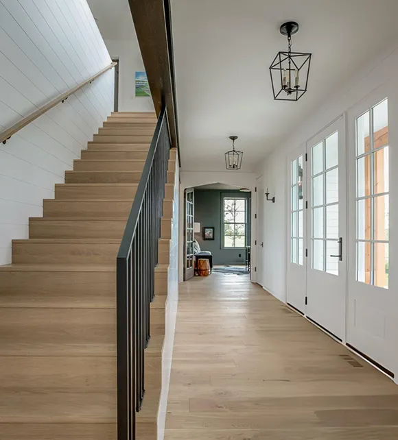 Elegant hardwood staircase installation in North Andover, MA, showcasing expert flooring services.