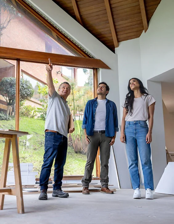 Happy clients in remodeled living space, representing affordable home remodeling services