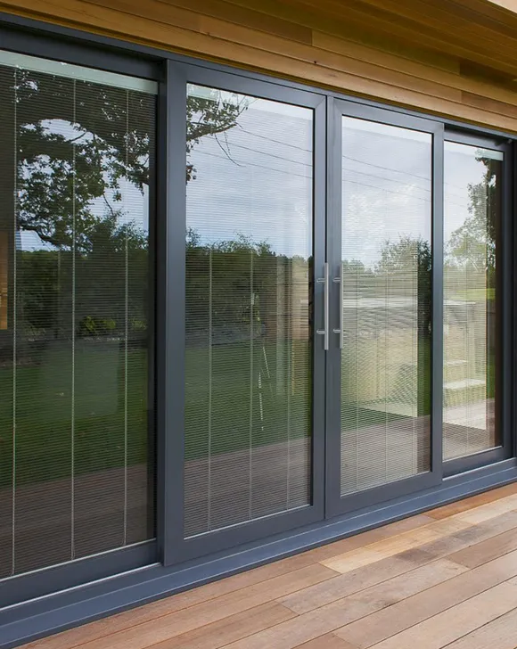 Modern sliding glass door installation in Manchester, MA, bringing natural light and seamless access to outdoor spaces.
